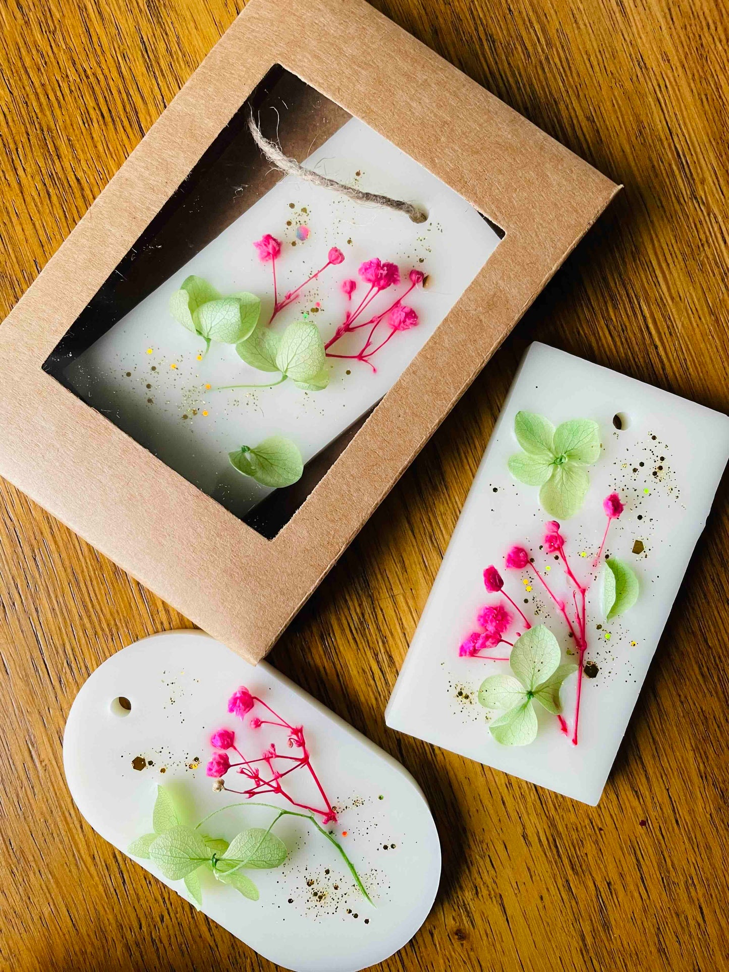 Thistle & Twigs Luxury Wardrobe Fresheners in kraft gift box with window - natural wax sachets decorated with pressed pink flowers and green hydrangea petals, handmade in Scotland